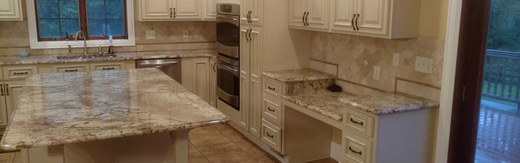 Traditional kitchen with cream cabinets, granite countertops and tile backsplash finished by AEB Services in Millsboro, DE